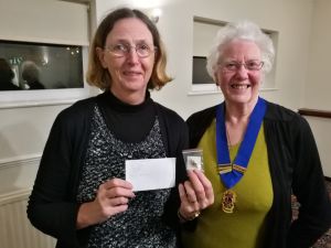 image: club member brigid receiving her badge